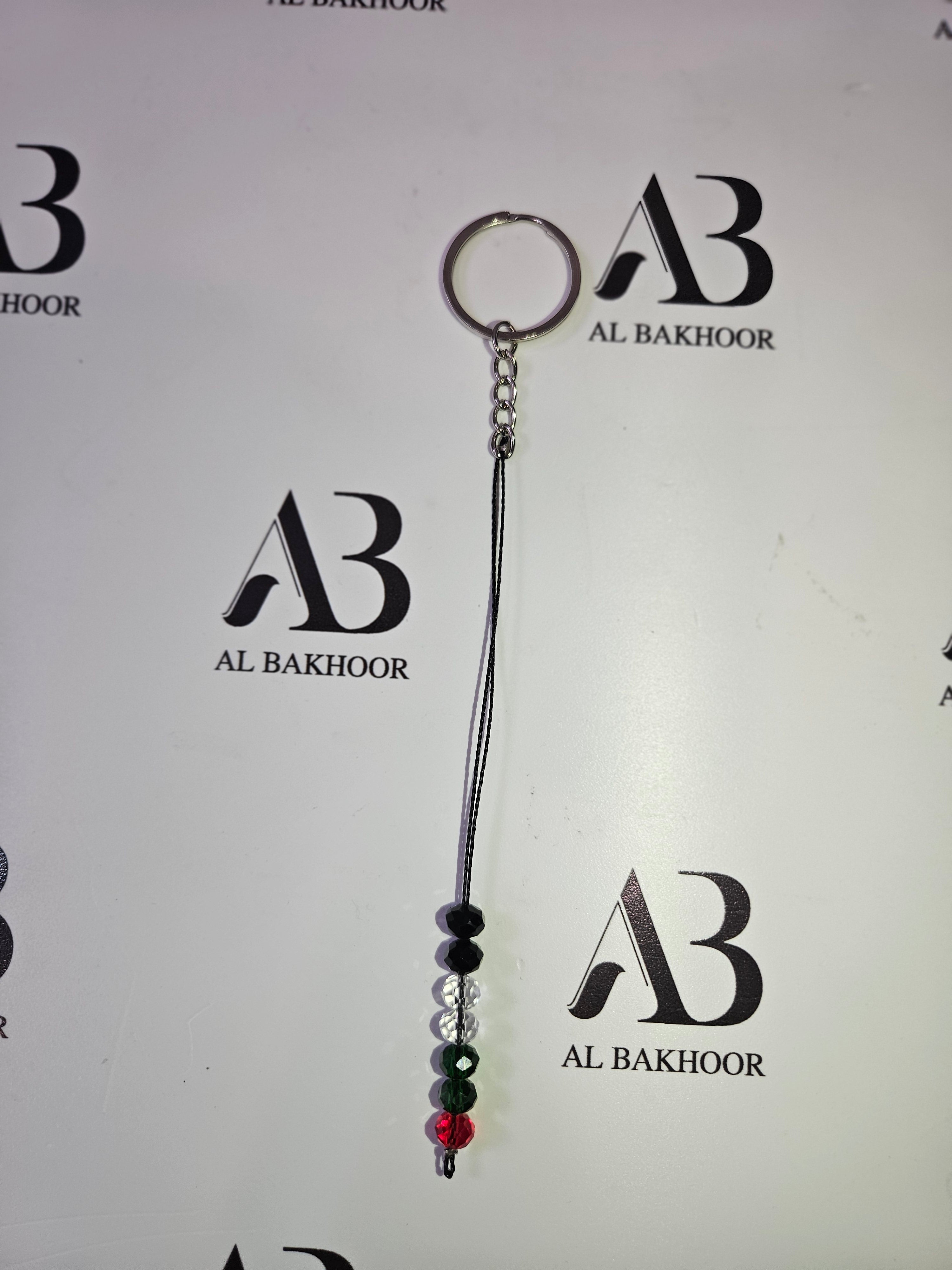 Red, Black, White & Green coloured beaded keyring