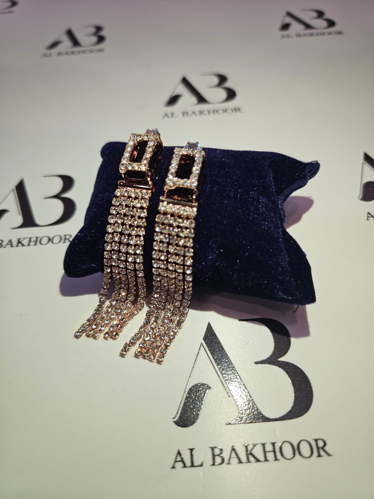 Brown dangling diamond earrings